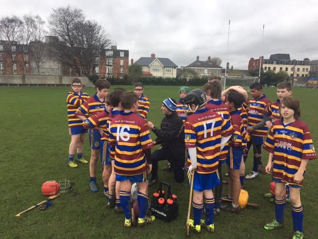 U13 Boys Hurling Manager Cathal O'Connell offers his team some instruction.