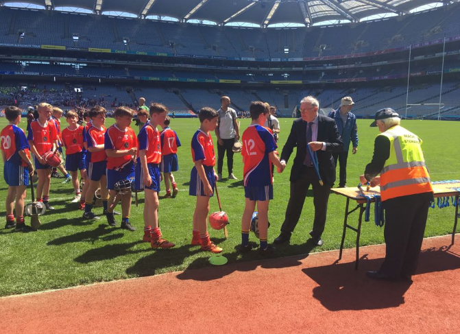 Belgrove players Jack, Paddy &amp; Rory collecting their medals.